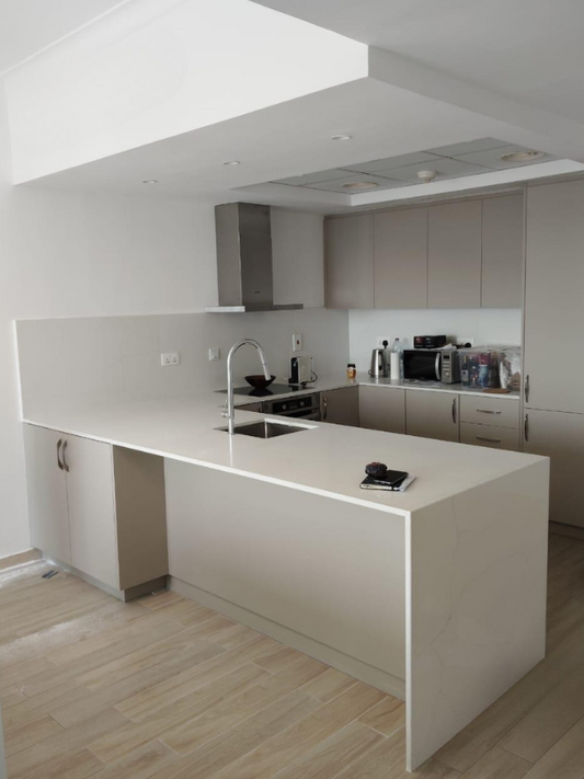 Open Kitchen with L-Shaped Quartz Countertop